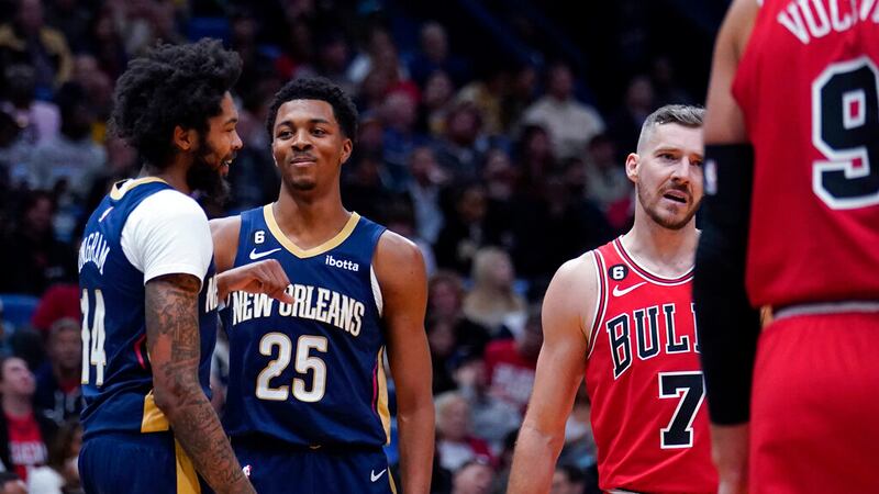 New Orleans Pelicans forward Brandon Ingram (14) laughs with guard Trey Murphy III (25) as...