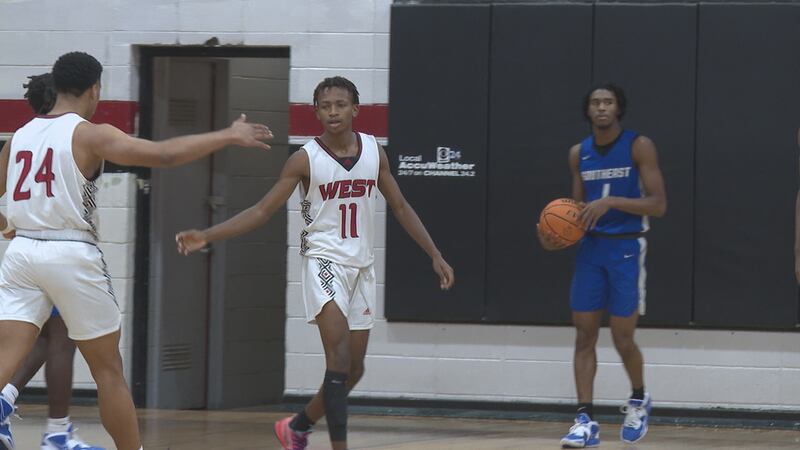 West Lauderdale's, Xavier Butler, high fives teammate in the Knights 60-49 win over Southeast...