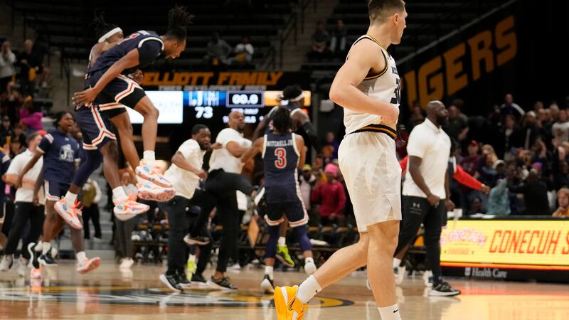 Missouri's Caleb Grill, right, walks away as members of Jackson State celebrate a 73-72...