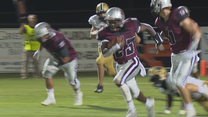 Clarkdale junior Ladonya Adams breaks through the pocket to run more than 90 yards for his...