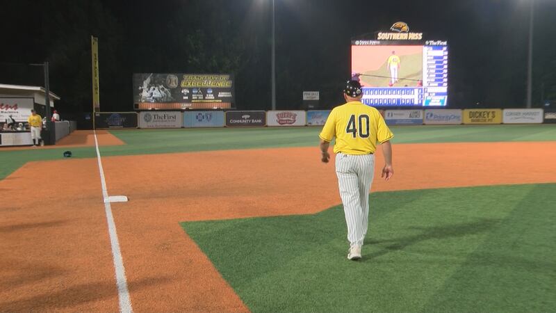Scott Berry walks to the outfield for the final time at Pete Taylor Park