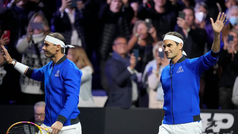 Team Europe's Roger Federer, right, and Rafael Nadal wave as they arrive for their Laver Cup...