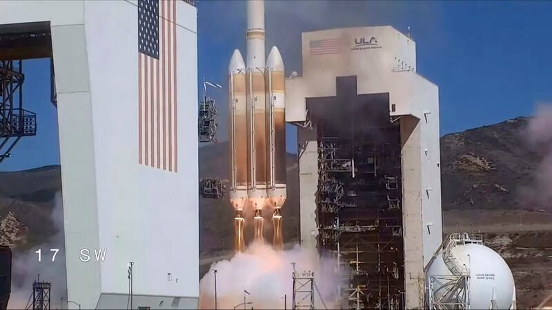 In this photo released by United Launch Alliance, a classified satellite for the U.S. National...