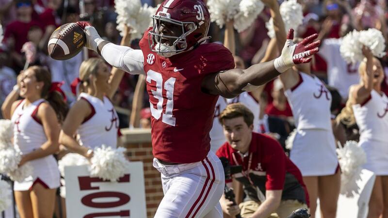Alabama linebacker Will Anderson Jr. (31) runs back an interception for a touchdown against...