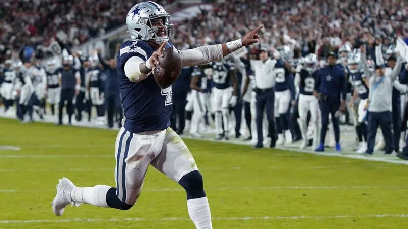 Dallas Cowboys quarterback Dak Prescott (4) runs into the end zone on a touchdown carry during...